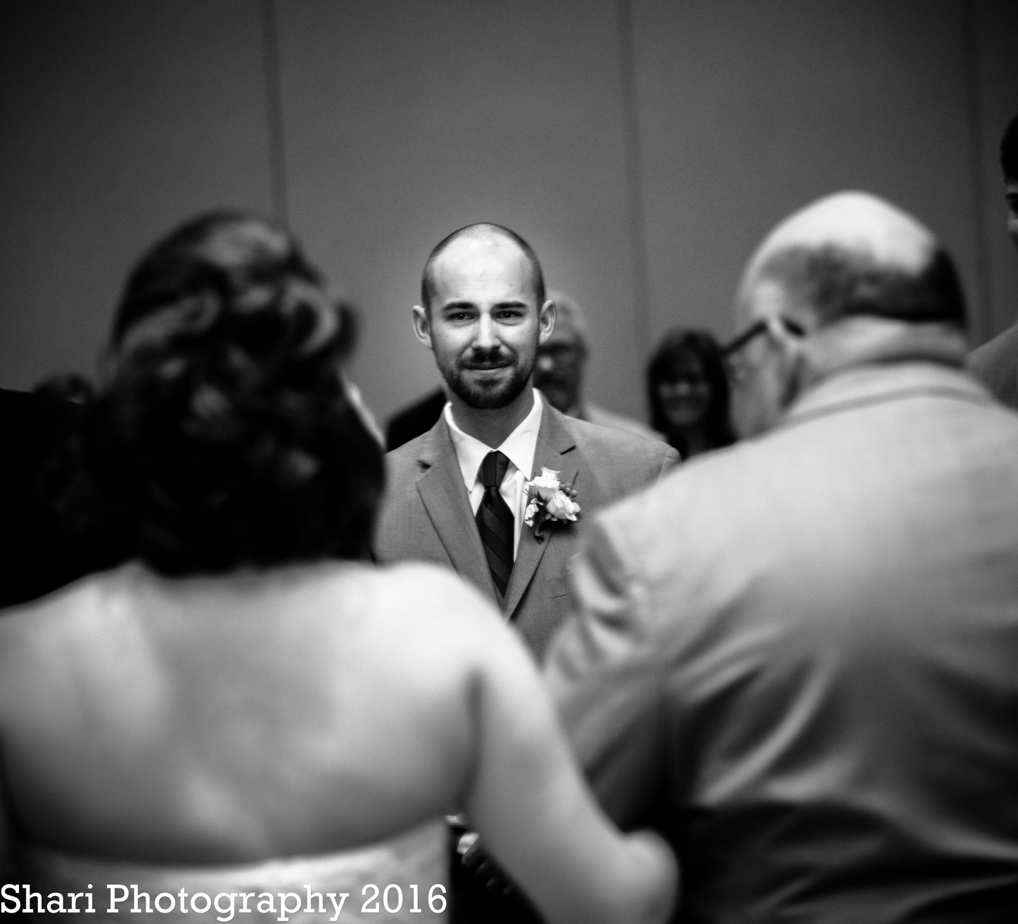 wedding groom sees bride