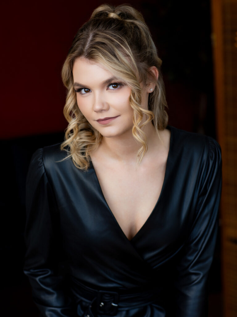 Bold fashion forward empowerment portrait St. Louis woman power pose