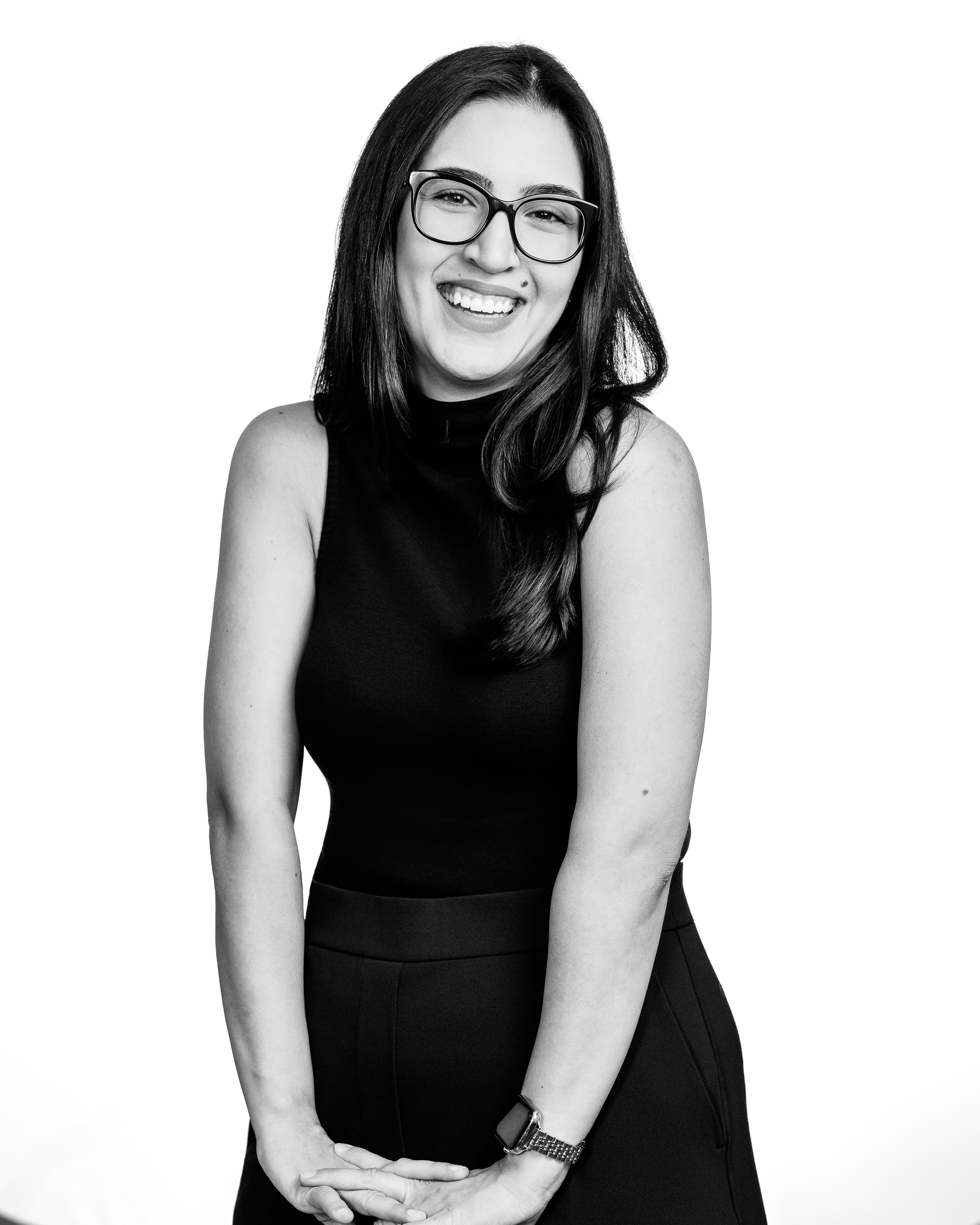Professional St. Louis businesswoman in polished personal branding headshot against clean neutral background